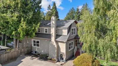 Home’s side view with spacious front and backyard