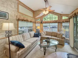 Living area w/vaulted ceilings & natural light