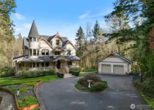A detached 2-car garage also includes a potting shed/yard tool space behind.