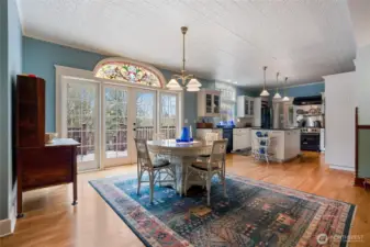A breakfast nook just off the kitchen also enjoys territorial views and French doors to the large Trex deck with hot tub.  The vintage stained glass above the door has been releaded to be able to be used indoor/outdoor.