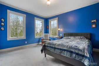 One of the 4 large bedrooms this home includes enjoys territorial views.