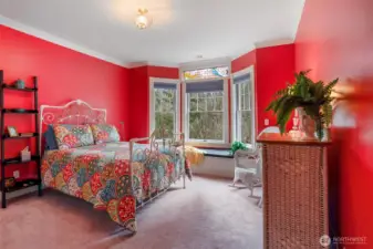 Another bedroom includes a bay window with storage and territorial views.