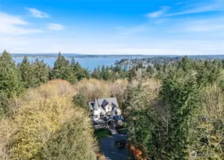 Aerial view of this Victorian home nestled in the woods near Kopachuck State Park in Gig Harbor, WA.