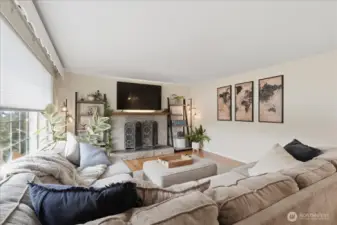 A classic stone fireplace is a nice focal point and brings warmth to the room.