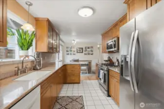 This updated galley style kitchen has beautiful sleek cabinetry for all your kitchen needs.