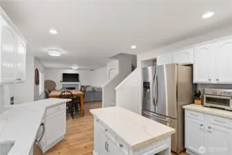 Kitchen with eat-in dining space opens to family room.