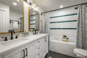 Primary Bedroom Bath with deep soaking tub/shower, double sinks and quartz countertops