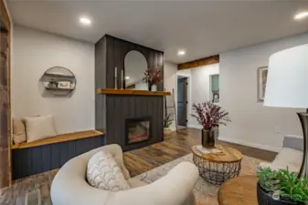 Living Room with Fireplace and doorways lead to Primary Bed & Bath and Utility/Mudroom