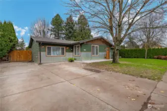 Large driveway and gate opens to RV parking