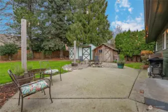 Patio, firepit and outbuildings