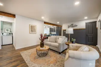 Living Room - Open to Kitchen/Dining with hall leading to Utility/Mudroom