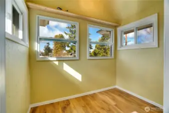 Set up a little reading nook, drawing table, or plant sanctuary in this room adjacent to the two 3rd floor bedrooms.