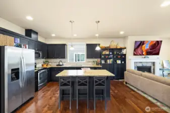 SS appliances and long kitchen sink.