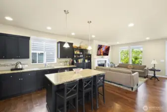 Elegant kitchen with granite island and work space countertops…