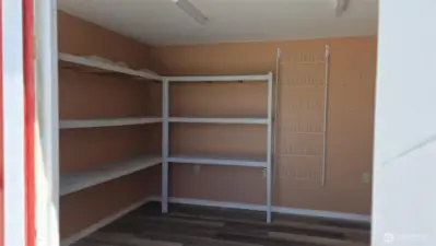 storage shelves inside red shed