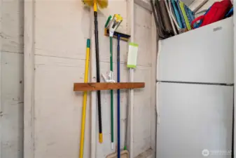 Half of the storage unit is pictured and the fridge is included.