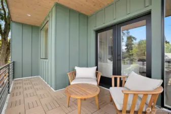 Sliding door off of the main living area leads to this covered outdoor patio.