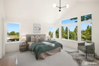 Large primary bedroom with vaulted ceilings, dual closets and en suite full bath.