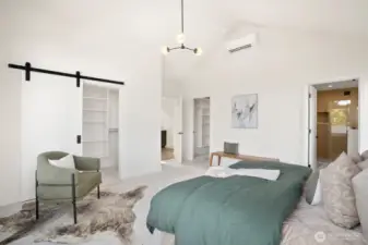 Primary suite is spacious with vaulted ceilings, dual closets and an en suite full bath with soaking tub.