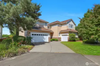 3 car garage offers ample space for storage, a workshop, or home gym.