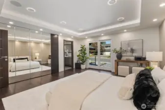 Wake up to light and space—with walk-in closet, tray ceiling, and private balcony access.