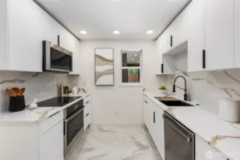 Quartz countertops with full-height backsplash and stainless appliances deliver both style and performance in this brand new kitchen.