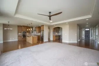 The view of from the Great Room. Entry on the right with entrance into the Dining Room and Wet Bar, the Kitchen and eating areas.