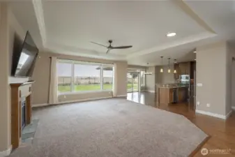 From the entry toward the Kitchen and informal dining area, and backyard.