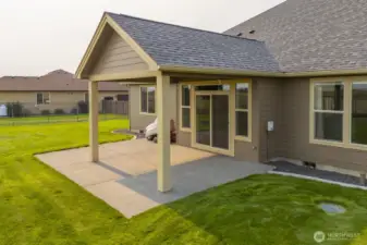Covered backyard patio, conveniently located off the the informal Dining Room and Kitchen.