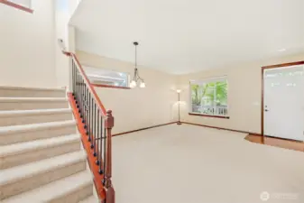 The staircase is conveniently situated between the living room and kitchen, offering easy access to the upper level without disrupting the flow of the main floor.
