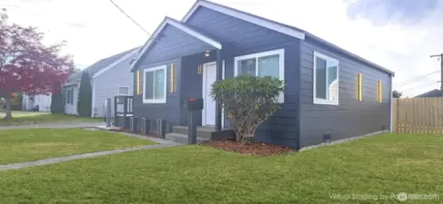 Virtually staged with refreshed green grass.