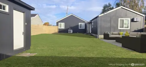 Virtually staged backyard with refreshed grass and added furniture. Spacious backyard may allow for an ADU on the main property; buyer to verify.