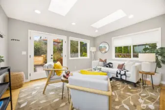 Light filled family room on east side of the home opens to a nicely landscaped back area with large patio.