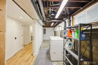 Washer/dryer are located in the unfinished portion of the lower level.  Can see the updated electrical and plumbing from open ceiling!  LVP flooring was installed in the hall and bedroom.