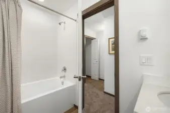 Spacious shared bath complete with a soaking tub.