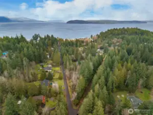 Escape on your own peaceful 3.6 acre lot dappled with the ideal blend of sunny lawn and shade under a canopy of evergreens.