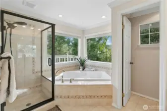 The views of trees help make this room beautiful.