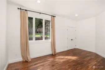 The guest bedroom on the main floor faces West onto the garden and pond.