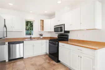 The full kitchen above the garage has it all! Stove/range, microwave, full fridge, dishwasher and double sinks.