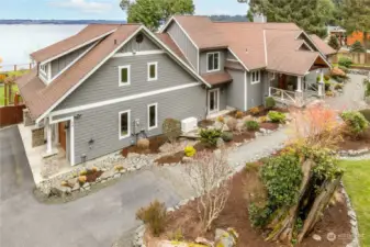 The Apartment is above the 1,000 sq ft garage on the left. The covered main entrance is on the right.