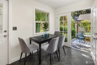 The eat-in dining space can be extended to the sun deck through these gorgeous French doors.