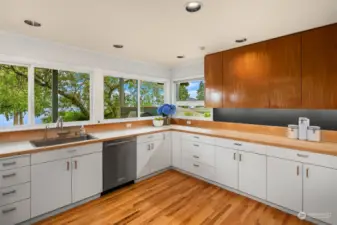 This chefs kitchen sports custom cabinetry and tons of storage.