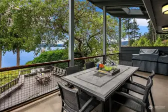 A cantilevered covered porch with sky lights and plumbed for a BBQ.  The perfect venue for hanging out and taking in nature's beauty year round.