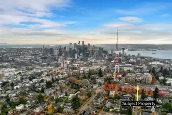 An aerial view of Queen Anne and beyond, offering a top-of-the-world feeling with sweeping vistas of the city, water, and surrounding landscapes