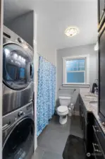 Full hall bath with tile flooring and granite counter tops.