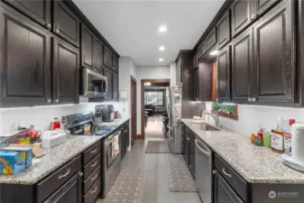 Lots of storage in the galley kitchen, tile flooring and LED undermount lights.