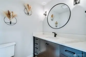 Powder room off family room.