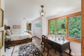 The primary bedroom is designed to take in the beauty and calm of the landscape.