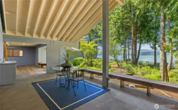 Covered view deck off Billiards Room with outdoor kitchen area and water/mountain views. Wired for hot tub!