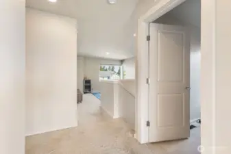 Leaving primary suite looking onto landing/loftspace